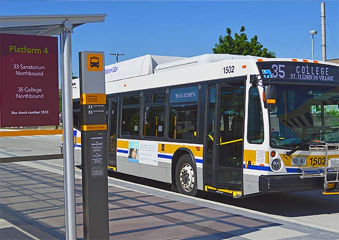 A Hamilton city bus at a bus stop